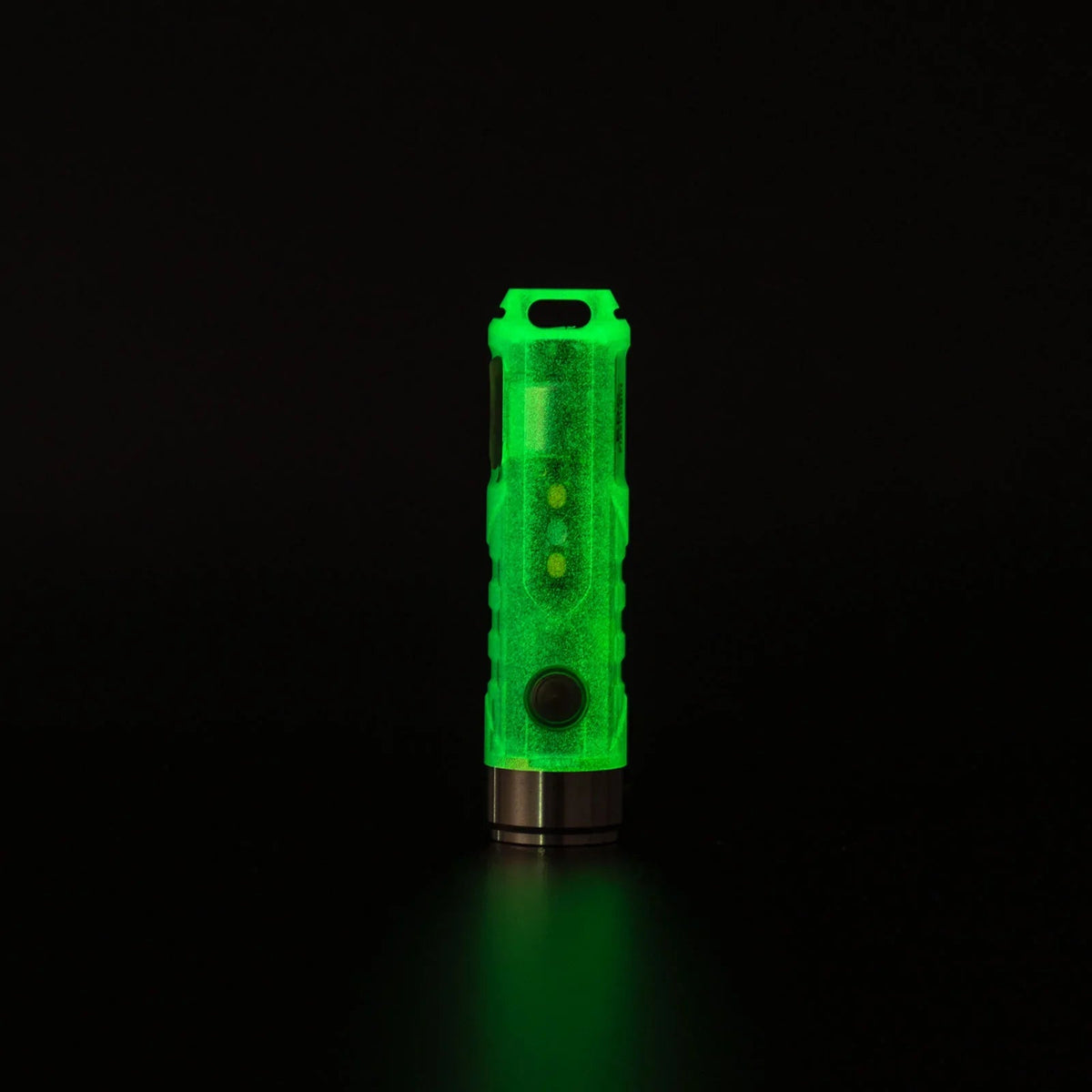 RovyVon Aurora A5 G4 glow-in-the-dark keychain flashlight illuminated in darkness
